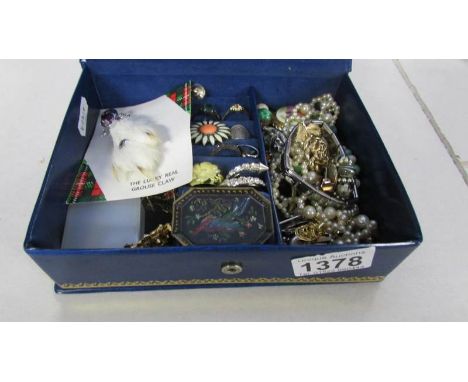 A box of vintage costume jewellery