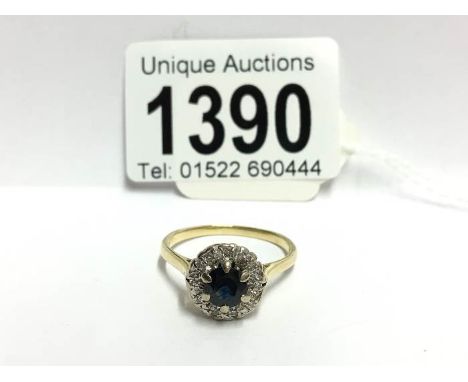 A vintage diamond and sapphire cluster ring set in 18ct gold, size V