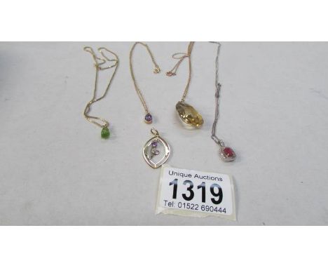 5 gold pendants with various stones including ruby and diamond set white gold pendant