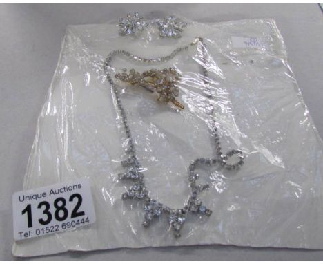 A vintage diamonte necklace, earrings and brooch