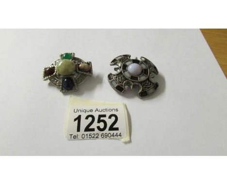 2 multi-coloured Celtic style brooches