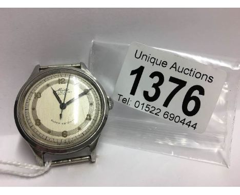 A vintage Mido super automatic watch head