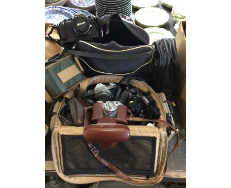 Quantity of cameras, accessories and bags, including a Nikkormat, Comet S, Minolta 5000, Nikon F-301, etc