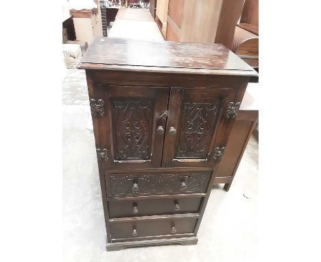 Old Oak cupboard with two carved panelled doors and three drawers below, 61cm wide, 36.5cm deep, 120cm high and an oak framed