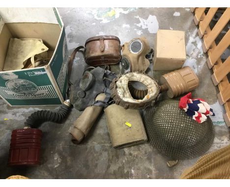 Lot of militaria including First World War officers binoculars, gas masks, Second World War helmet etc