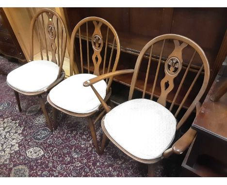 Five Ercol dining chairs comprising 4 standards and one elbow, together with a Piano stool (6)