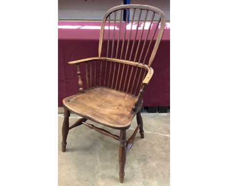 Mid 19th century Windsor elm and ash elbow chair, with arched stick back, saddle seat on turned splayed legs