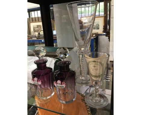 Pair of Victorian amethyst cut glass scent bottles with enamel eau de cologne and rose water labels, Georgian ale glass and a