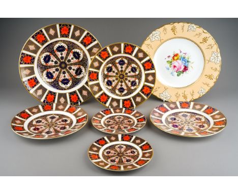 Six Royal Crown Derby Imari 1128 pattern plates, comprising a dinner plate, three 21.5cm dessert plates and two 16cm tea plat