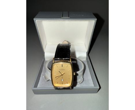 A 9ct gold Roamer wristwatch. The champaign coloured dial, black enamel gilt hourly applied markers, black enamel gilt hands 