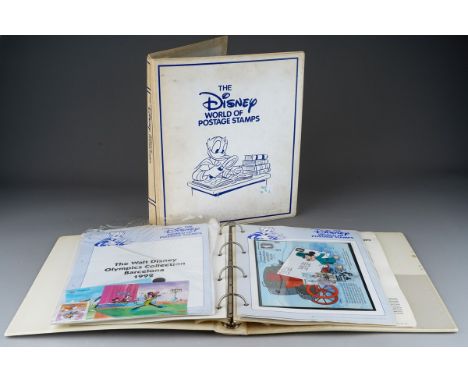 Two "The Disney World of Postage Stamps" albums, one containing forty Disney first day covers, the other with sheets and othe