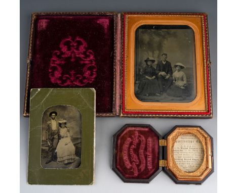 A late 19th Century black and white family portrait group, the glazed and gilt frame within leather bound case probably Ameri