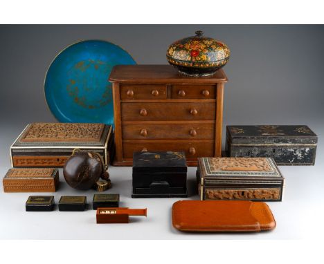 A collection of treen boxes, miniature Victorian style chest of drawers, nut, three 19th century papier mache rectangular snu