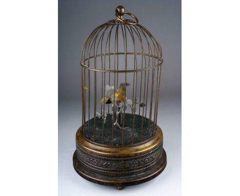 A Bontems style clockwork singing bird automaton, late 19th or early 20th century, probably French, the chirping feathered bi