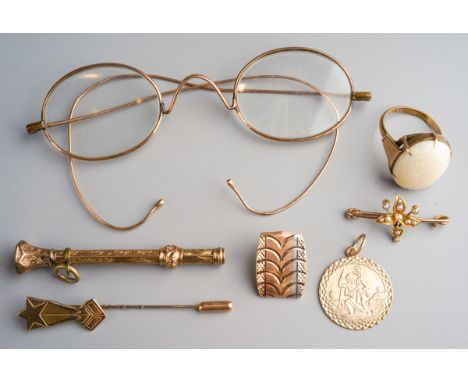 Yellow metal (test as 9k gold) spectacles, 9k gold scarf pin, yellow metal and seed pearl brooch, 9k gold pendant, 14k button