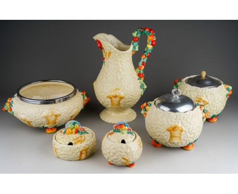 A collection of five Clarice Cliff designed Newport Pottery "Celtic Harvest" items to include: large beer jug; a large bowl w