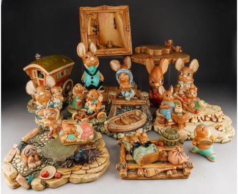 A collection of Pendelfin buildings, display stands and figures, including a Curiosity shop with original box, a gypsy carava