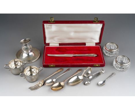 A parcel of items of silver, comprising an early 20th century capstan inkwell, damaged clear glass silver liner, rubbed marks