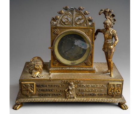 A late 19th century gilt probably Austrian metal figural mantel clock, the central gothic arched case containing worn silvere