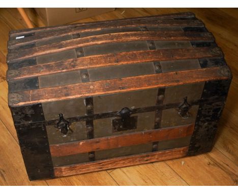 A vintage trunk with beech slat supports, fitted interior with 1920s decoupage style decoration, 67 x 38 x 42cm, leather carr