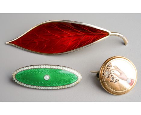 David Andersen, Norway sterling silver and red enamel leaf brooch together with green and white enamel silver brooch and a ye