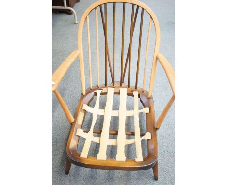 Ercol low armchair with spindle back partly stripped (photographed without cushions) 