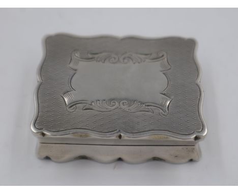 Hallmarked silver snuff box, with gilt washed interior, vacant cartouche and engine turned decoration, 55g. Hinge works well,