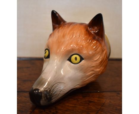 A 19th century Pratt type fox head stirrup cup with painted detail and inscribed 'Tallyo', unmarked, length 12cm.Provenance: 