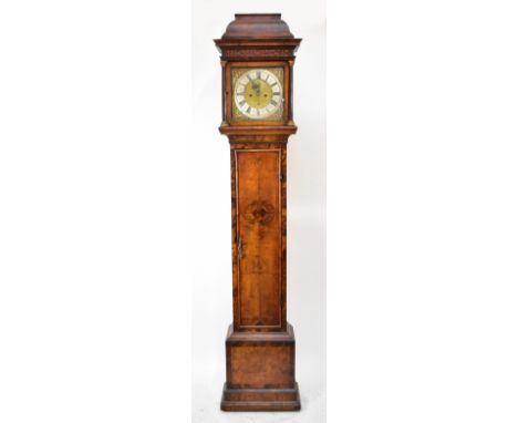 A Queen Anne walnut longcase clock, the domed caddy top above fret carved panel and 12" square brass dial inscribed 'Sam Ogbo