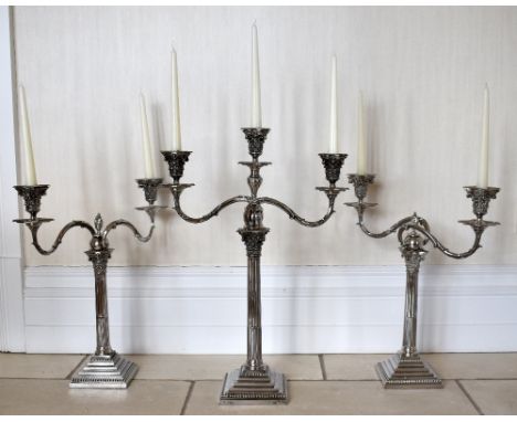 RICHARD HOOD I & RICHARD HOOD II; a set of three late Victorian hallmarked silver candelabra, the larger example with twin sc