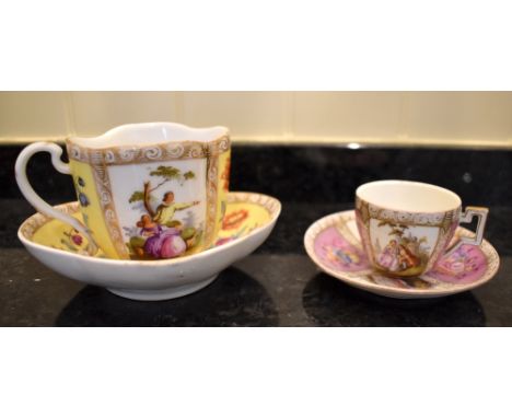 A late 19th century Continental porcelain cup and saucer with opposing vignettes of figures in landscape and floral sprays on