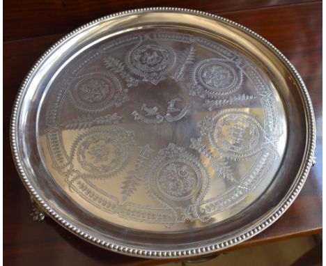 WILLIAM & JOHN BARNARD; a late Victorian hallmarked silver circular tray with fine floral and fruit engraved detail, with cen