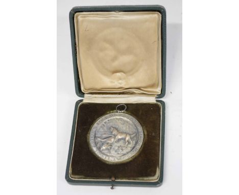Cased Third Reich 1938 dated German dog hunting medal with scenes of stag hounds inscribed "LandesjagdverBand Hessen D.J.V." 