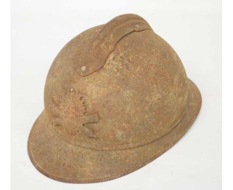 French M15 pattern Army helmet with Artillery badge to front and comb on top (a/f), heavily rusted and remnants of liner insi