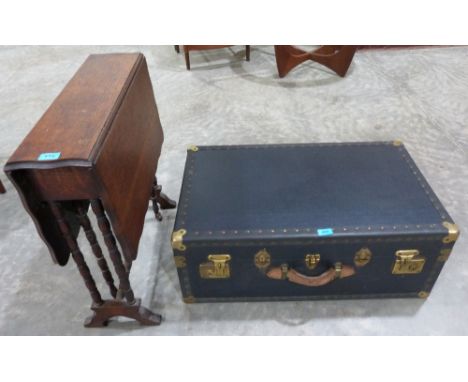 An oak sutherland table and a cabin trunk