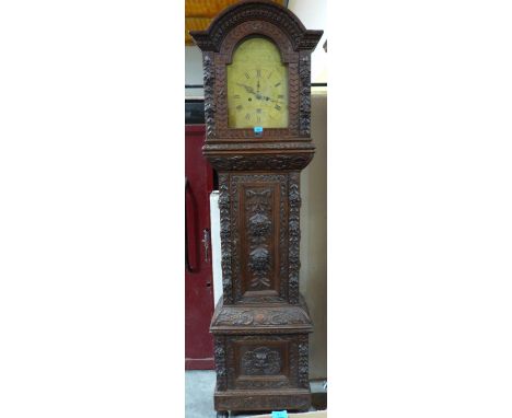 A 19th century oak carved 8 day longcase clock, the break-arch brass dial signed Alex Feguson, Couper Fife. 89½' high