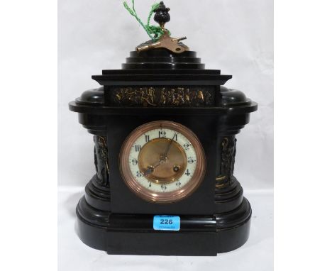 A French slate mantle clock of architectural form, the two train brass drum movement striking on a coiled gong. 14½' high