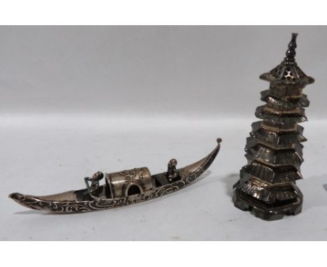 A Chinese silver pagoda 3' high and a silver model of a boat