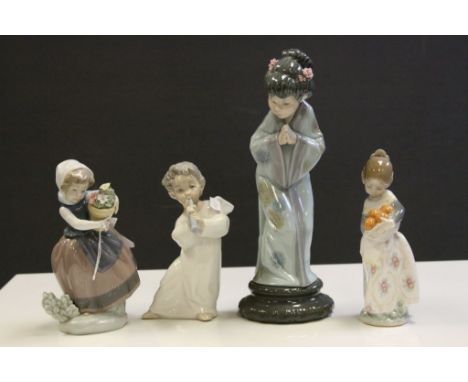 Four vintage Lladro ceramic figurines to include a girl with basket of Oranges, girl with basket of Flowers, winged Child pla