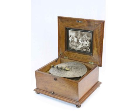 An 11" dual comb sublime harmony Polyphon disc musical box. C.1895. in good working order and with a quantity of discs