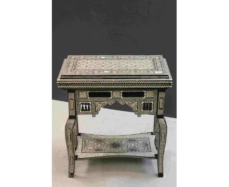 Egyptian Lacquered Games Table with extensive Mother of Pearl Inlay, the hinged lid opening to reveal backgammon board and li