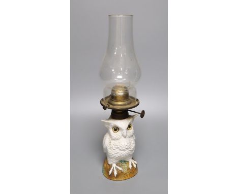 A Possneck porcelain 'owl' novelty oil lamp, total height including chimney 37.5cm