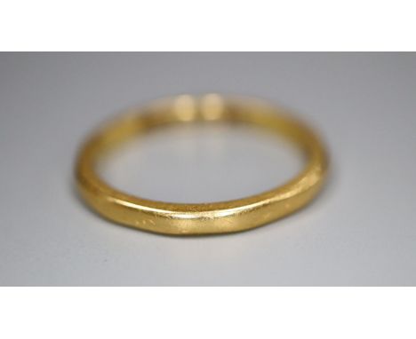A 22ct gold wedding band, size K, 2.4 grams.