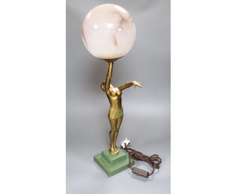 An Art Deco spelter figural table lamp, with semi-nude dancer holding a glass shade aloft, 64cm overall