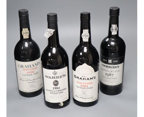 Four bottles of vintage port; two Graham's Malvedos 1976 and 1984, one Warres Quinta da Cavadinha 1984 and one Cockburn's Qui