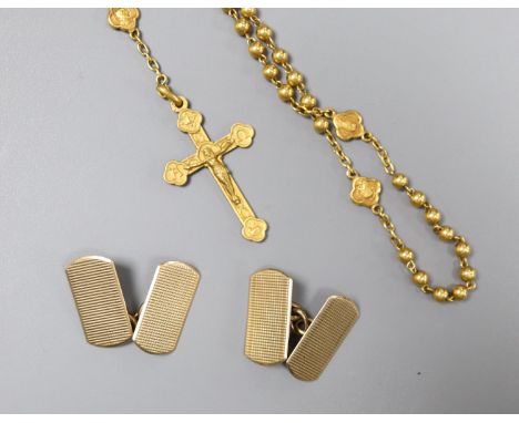 A pair of engine-turned 9ct gold oval cufflinks, 3.9 grams and a yellow metal rosary (tests as 18ct), 7.1 grams, in a small l