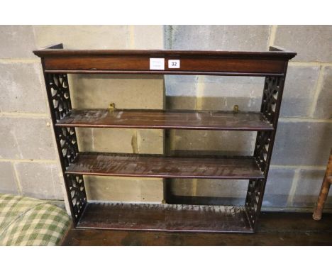 A George III style mahogany three shelf wall bracket, width 74cm, depth 16cm, height 67cm