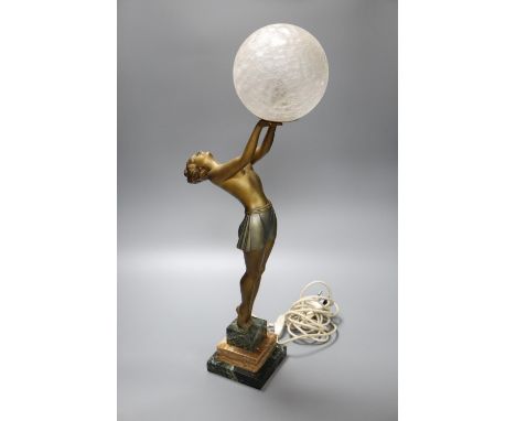 An Art Deco spelter table lamp, with female holding glass shade aloft, on stepped square base, 55cm