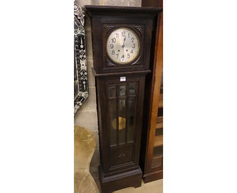 A 1930's oak cased eight day striking longcase clock, 173cm high