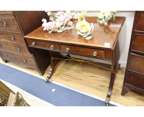 A Regency satinwood banded mahogany sofa table, with two ebony beaded drawers, on ebony strung standard end supports, fitted 